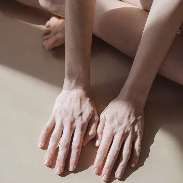 Woman's hands bathed in sunlight