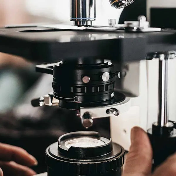 Scientist using a microscope