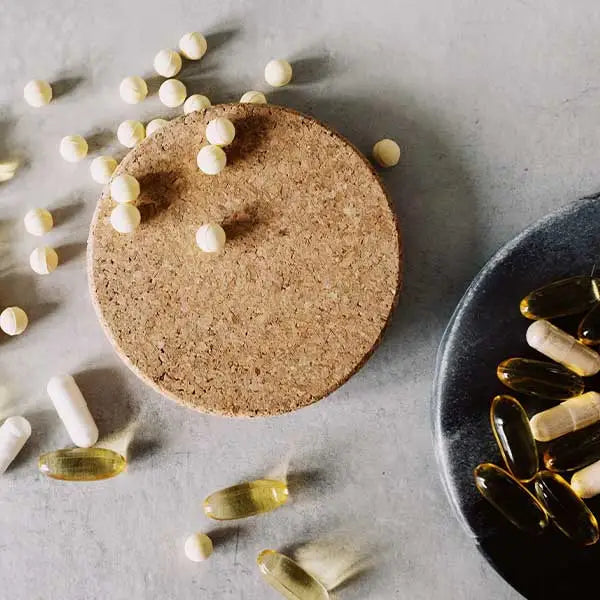 Range of supplements scattered across countertop