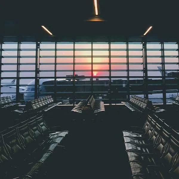 Empty airport gate with plane outside the windows