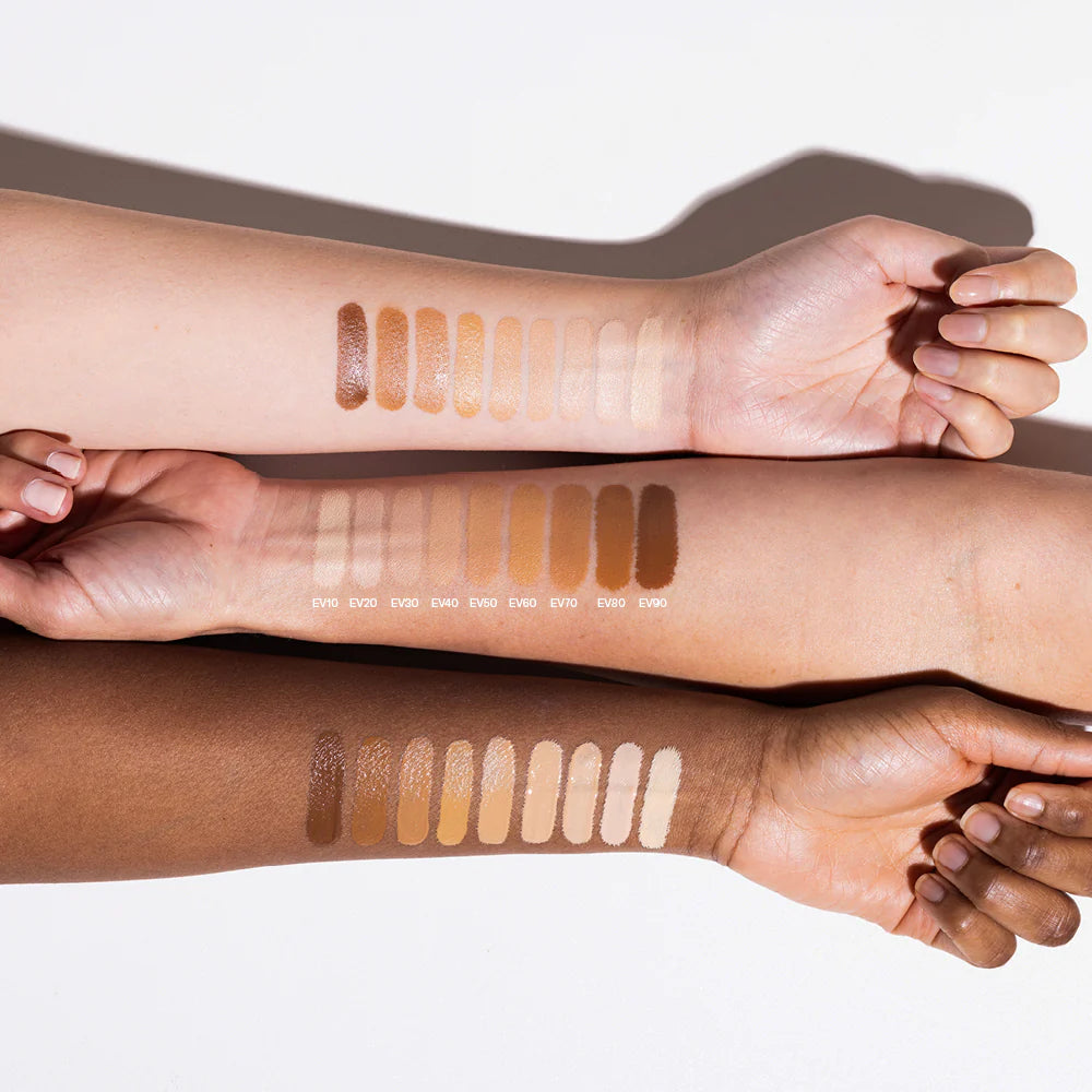 Synergie Minerals EnviroVeil liquid foundation shades displayed on three different skin tones